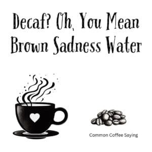 White ceramic coffee mug with black text reading Decaf? Oh, You Mean Brown Sadness Water in bold lettering