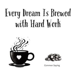 White ceramic mug with black text reading Every Dream Is Brewed with Hard Work motivational coffee quote