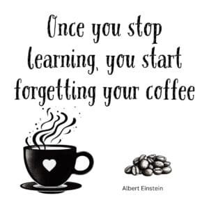 White ceramic coffee mug with Einstein quote about learning and forgetting coffee printed in black text