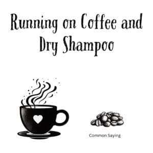 White ceramic mug with black text reading Running on Coffee and Dry Shampoo in modern typography