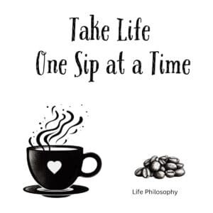 White ceramic coffee mug with black text reading Take Life One Sip at a Time on white background