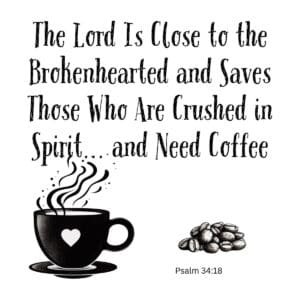 White ceramic coffee mug with Psalm 34:18 Bible verse quote about brokenhearted and needing coffee printed in black text