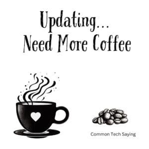 White ceramic coffee mug with Updating Need More Coffee quote in black text for tech lovers and programmers