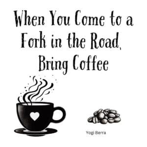 White ceramic coffee mug with quote When You Come to a Fork in the Road Bring Coffee attributed to Yogi Berra
